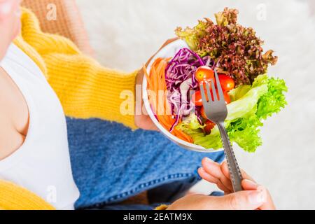 woman eating fresh salad meal vegetarian Stock Photo