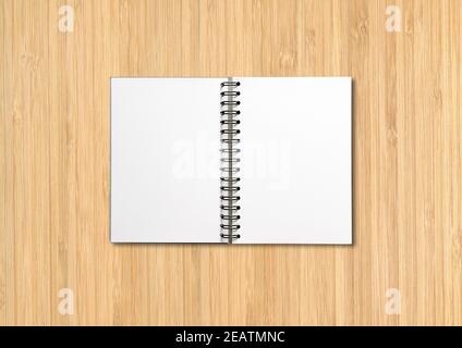 open spiral notebook with blank pages and pen isolated on white