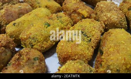 Spicy and delicious fried croquettes with a closeup perspective view Stock Photo