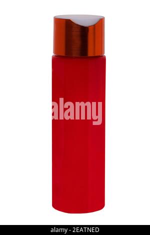 Close-up of a red plastic bottle for shampoo or soap, cream, serum, skin care or other cosmetic and beauty products without label isolated on a white background. Macro. Stock Photo