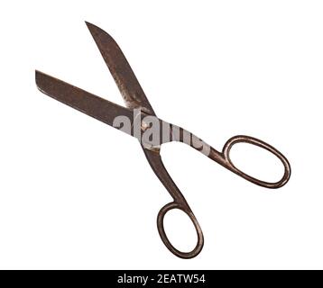 Antique insulated on white old rusty metal scissors, close up, shallow depth of sharpness Stock Photo