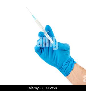 Male hand in blue gloves holding a plastic syring with liquid for injection isolated on white background. Health care, treatment concept Stock Photo