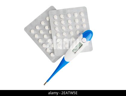 Blister with pills and electronic body thermometer displaying human body temperature. Isolated on white Stock Photo
