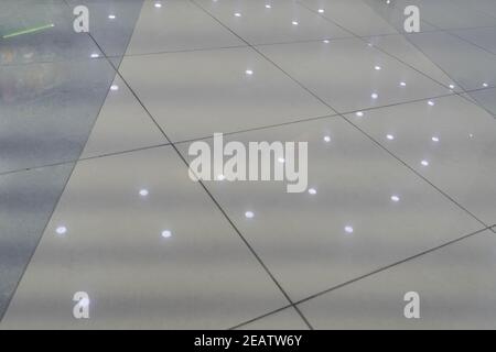 Marble floor in a public building with ceiling lights reflections Stock Photo