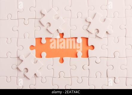 paper plain white jigsaw puzzle game texture incomplete or missing piece Stock Photo