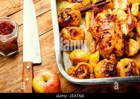 Roasted chicken with apples Stock Photo