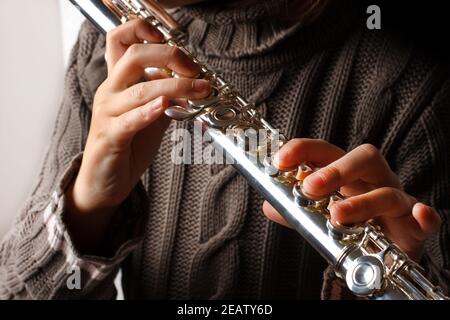 Girl playing flute Stock Photo