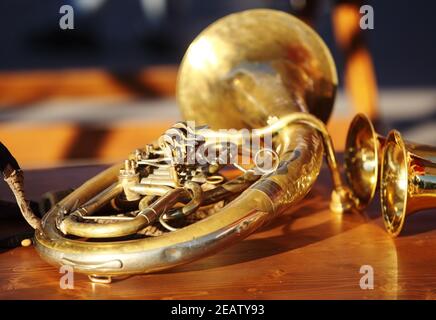 Blowing brass instrument on table Stock Photo