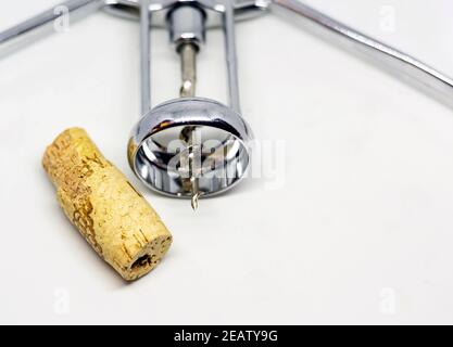steel wing corkscrew with a perforated cork Stock Photo