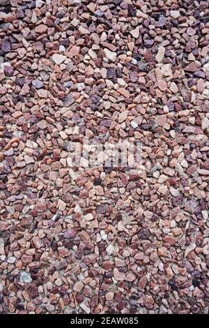 Decorative exterior coating of warm colored marble crumb close-up Stock Photo