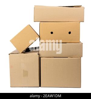 stack of closed cardboard brown paper boxes isolated on white background Stock Photo