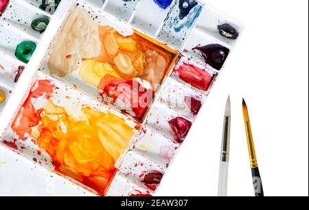 Watercolor Tray and Paintbrush on white background Stock Photo