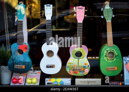 Ukuleles in music shop window. Stock Photo