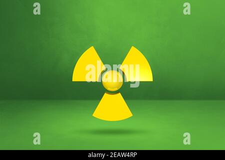 Radioactive symbol on a green studio background