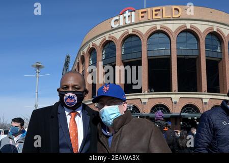 Queens Borough President Donovan Richards and New York Mets baseball team owner Steve Cohn pose in front of Mets Citi Field stadium on opening day as a COVID-19 Vaccine Mega Hub in the Flushing Meadows-Corona Park section of Queens, New York, NY, February 10, 2021. With only 250 vaccine doses available on the first day, prioritization went to livery car drivers (taxi and Uber), food service workers and Queens residents only, as more doses become available the site is expected to run 24hrs a day and serve more than 5000 daily doses of the vaccine. (Photo by Anthony Behar/Sipa USA) Stock Photo