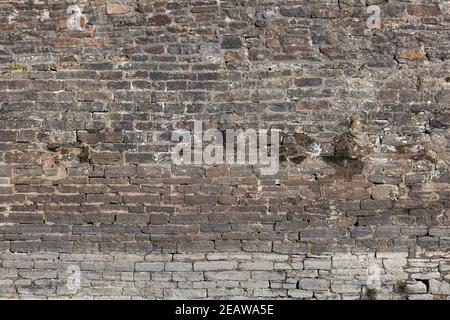 weathered distressed red brick wall texture background Stock Photo