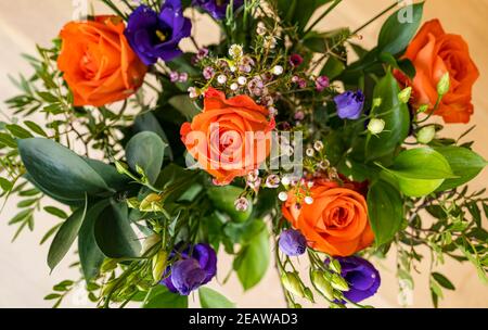 Close up of bouquet of flowers with orange roses Stock Photo