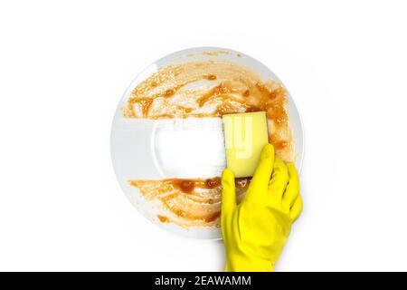 hands in rubber yellow gloves for protection washing dirty plate with foam sponge isolated on white background top view, Healthy and cleaning business concept Stock Photo