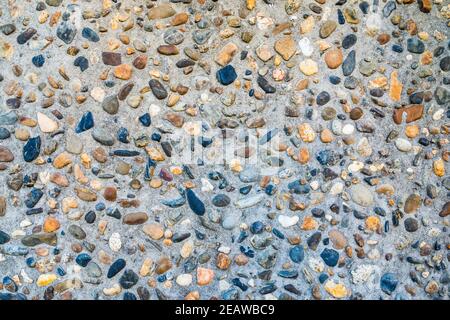 Small pebble and cement floor background Stock Photo