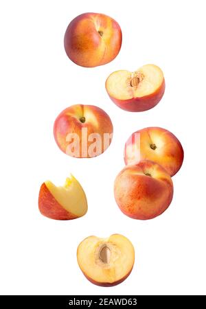 Falling sliced peach fruit isolated on white Stock Photo