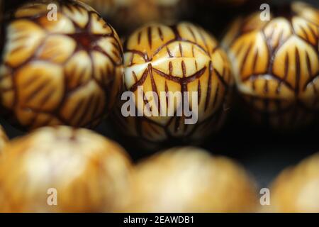 Beautiful wooden prayer beads or rosary with a striped background Stock Photo