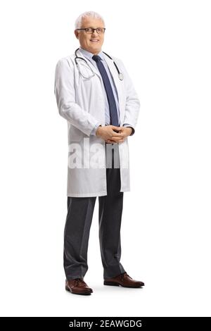 A Male Doctor, On A White Background, In Full Height, Shows A Sign Of 