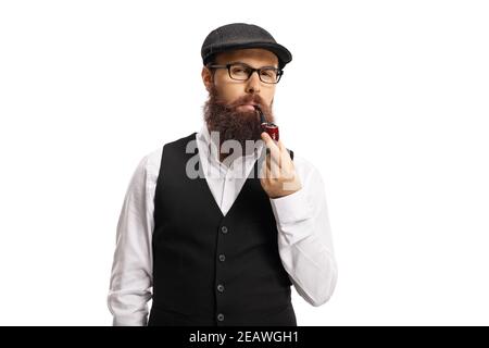 Bearded man with glasses and hat smoking a pipe isolated on white background Stock Photo