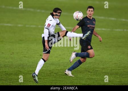 Swansea, UK. 10th Feb, 2021. Yan Dhanda of Swansea city controls the ball. The Emirates FA Cup, 5th round match, Swansea city v Manchester City at the Liberty Stadium in Swansea, South Wales on Wednesday 10th February 2021. this image may only be used for Editorial purposes. Editorial use only, license required for commercial use. No use in betting, games or a single club/league/player publications. pic by Andrew Orchard/Andrew Orchard sports photography/Ģ����ý Live news Credit: Andrew Orchard sports photography/Ģ����ý Live News Stock Photo