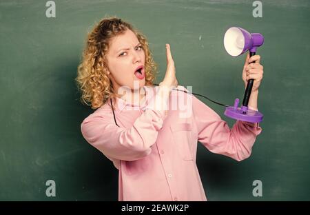 ray of light. education concept. back to school. teacher with lamp at school blackboard. student girl working with electricity. enlightenment. idea and inspiration. brainstorming woman. Stock Photo