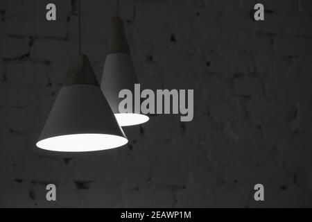 Abstract interior fragment, two hanging spot lights in dark room Stock Photo