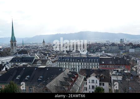 Zurich, Switzerland - 03 12 2020: Panorama of Zurich historical center. Green church tower of Predigerkirche, is on the left hand side. Panoramic view Stock Photo
