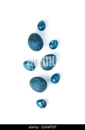 Beautiful Easter eggs of deep blue color isolated on a white background. Top view Stock Photo
