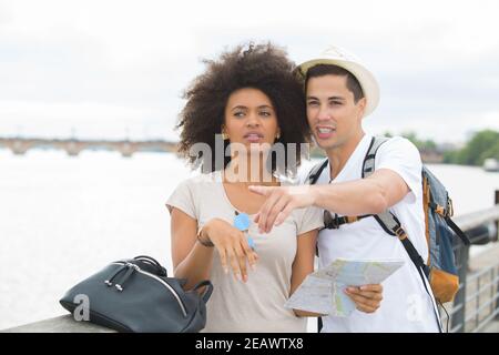 couple on holidays pointing at something Stock Photo