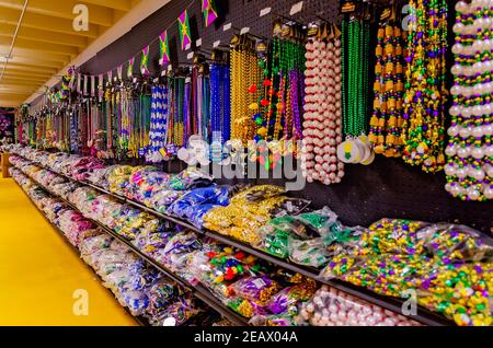 Mardi Gras beads line the shelves at Toomey’s Mardi Gras shop, Feb. 8, 2021, in Mobile, Alabama. Stock Photo