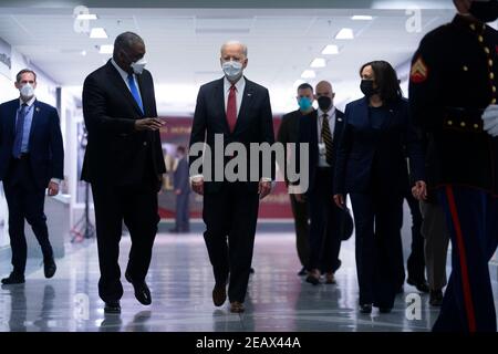 US President Joe Biden (C), with US Vice President Kamala Harris (R) and US Secretary of Defense Lloyd Austin (L), tours the African Americans in Service Corridor at the Pentagon in Arlington, Virginia, USA, 10 February 2021.Credit: Michael Reynolds/Pool via CNP /MediaPunch Stock Photo