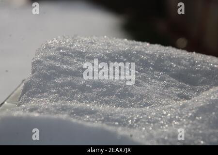 Snow on elevated surface, with blurred snow in background Stock Photo