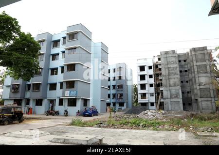 A ground level view of a completed apartment and a under construction apartment Stock Photo