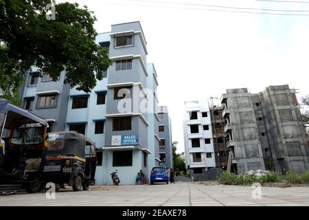 A ground level view of a completed apartment and a under construction apartment Stock Photo