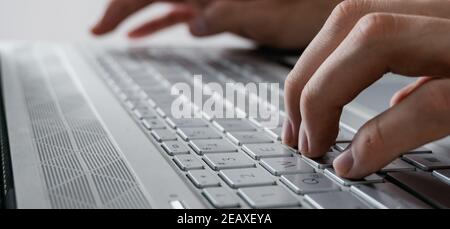 man's hands typing on a modern computer all gray, photo without background Stock Photo