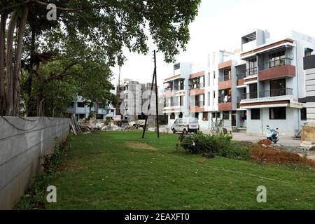 A ground level view of a completed apartment and a under construction apartment Stock Photo