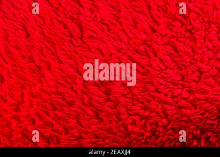 Saturated bright dark red background texture fabric felt Stock Photo