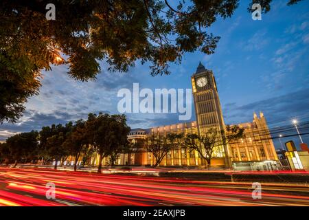 Big Ben and Car light trails against colorful sunset in London, England, UK. Stock Photo