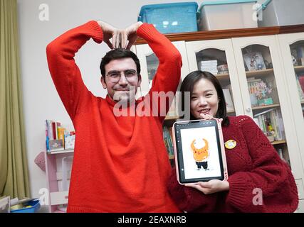 Wuhan, China's Hubei Province. 6th Feb, 2021. Li Jing (R), an illustrator in Wuhan, creates illustrations with Israeli blogger and entrepreneur Raz Galor in Wuhan, central China's Hubei Province, Feb. 6, 2021. Credit: Xiong Qi/Xinhua/Alamy Live News Stock Photo