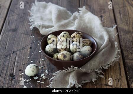 Boiled quail eggs on a wooden table, selective focus, rustic style, horizontal Stock Photo