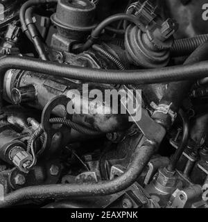 Car repair, car service concept. Fragment of  engine compartment of diesel truck. Engine, exhaust manifold, high pressure fuel pump, piping and gauges Stock Photo