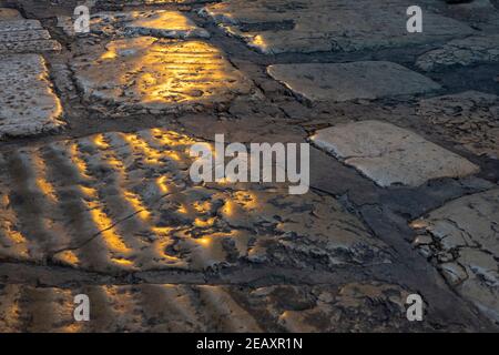 A section of ancient paved Roman road in the Christian Quarter old city of Jerusalem Israel Stock Photo