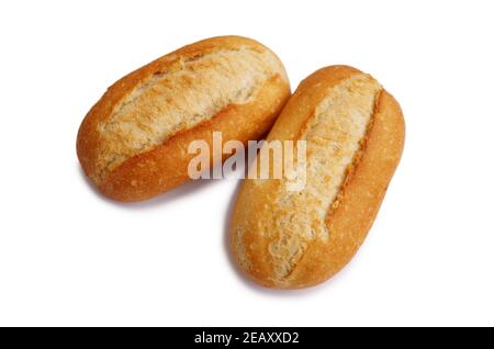 Two fresh crusty mini baguettes isolated on white bacground. Small baguette rolls. Food and breakfast background. Worldwide hunger concept. Stock Photo