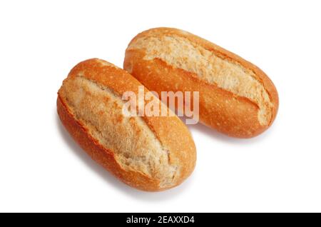 Two fresh crusty mini baguettes isolated on white bacground. Small baguette rolls. Food and breakfast background. Worldwide hunger concept. Stock Photo