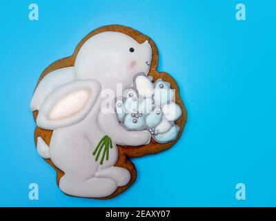 gingerbread in the shape of an Easter bunny that holds a bouquet of flowers  Stock Photo