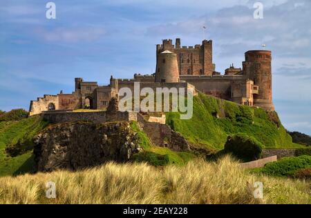 Bamburgh Castle, Northumberland. Built on an outcrop of volcanic dolerite, the castle is one of the largest inhabited castles in England. Stock Photo